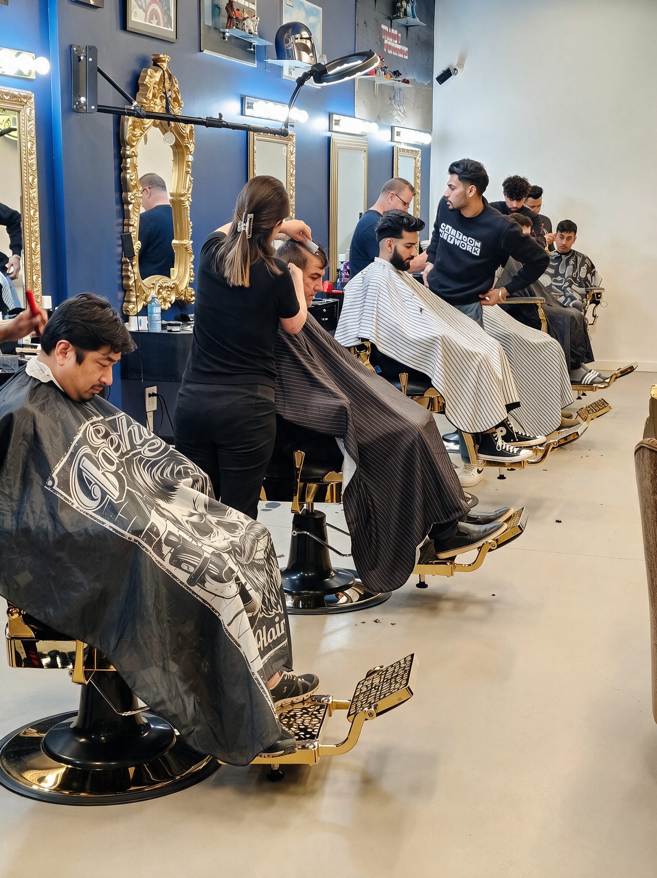 A row of gold chairs on the Academy floor with students cutting