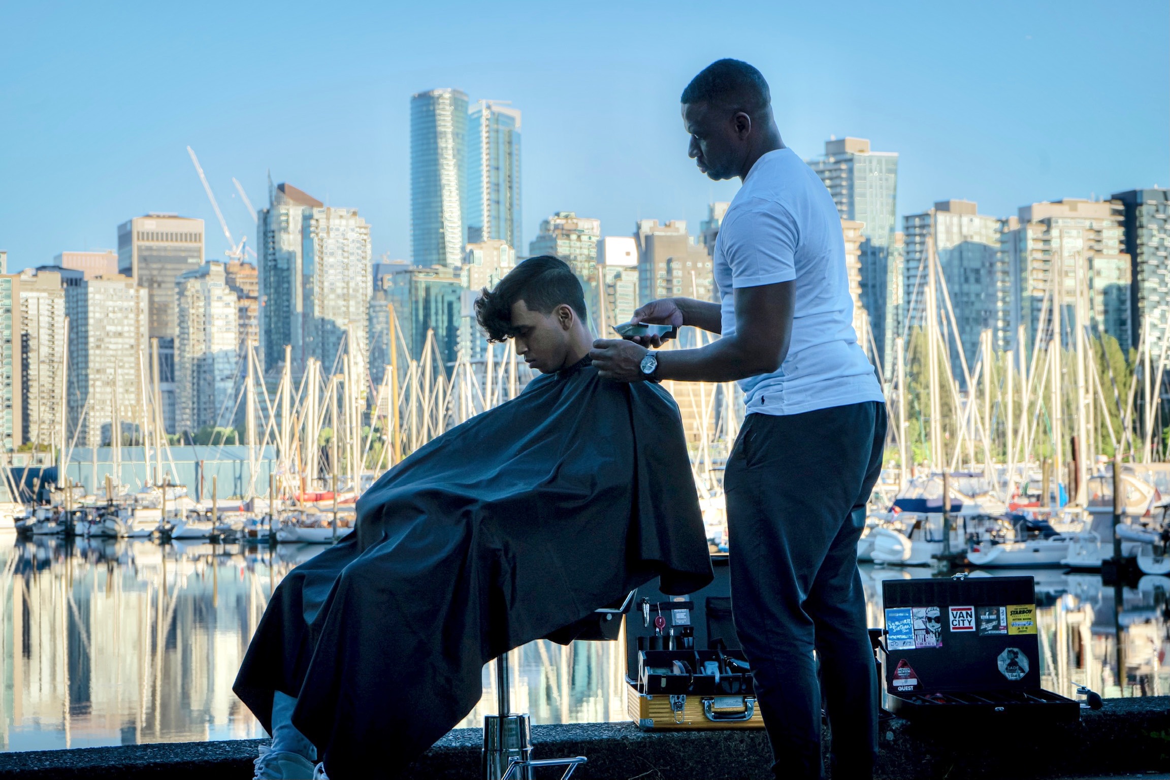 Junior providing focused grooming care outdoors in Vancouver