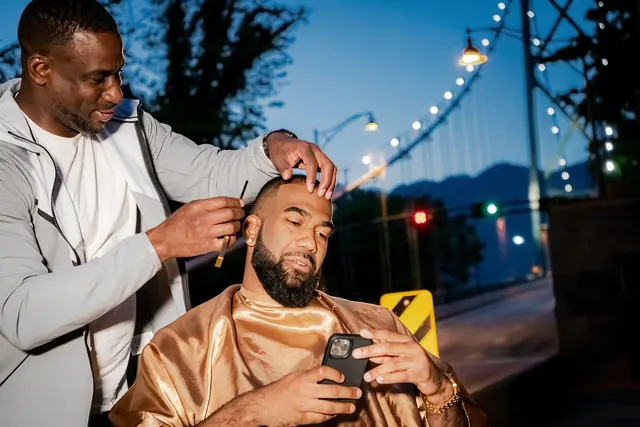 Barbering outdoors at dusk in Vancouver